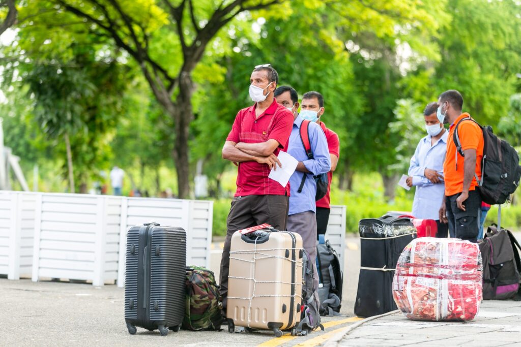 group of immigrant with their luggages